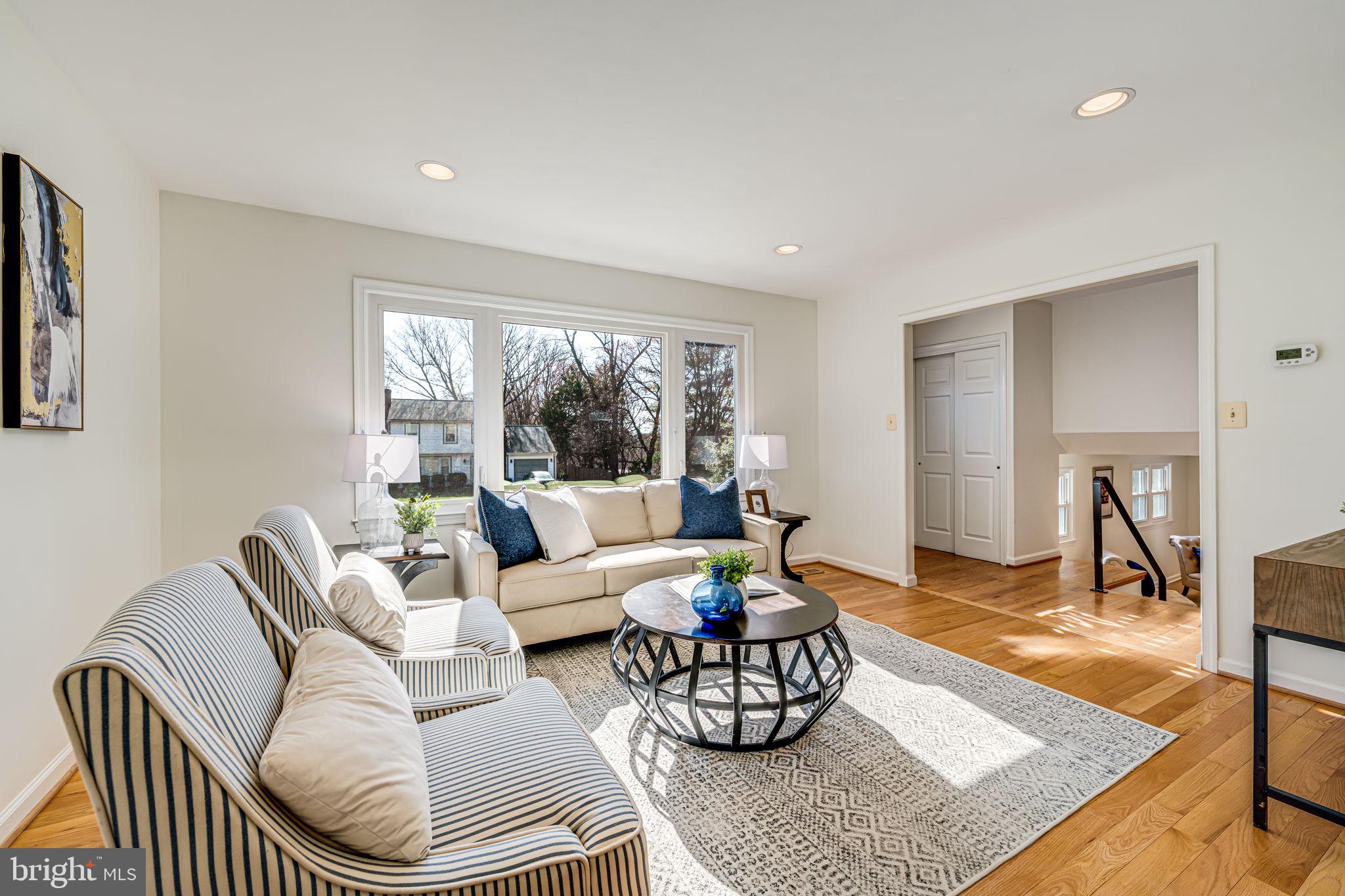 1831 Quartet Circle Vienna, VA 22182 - Photo 9 of 60 a living room with furniture and a table