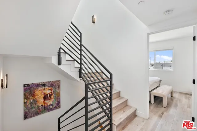 a view of room with furniture and wooden floor