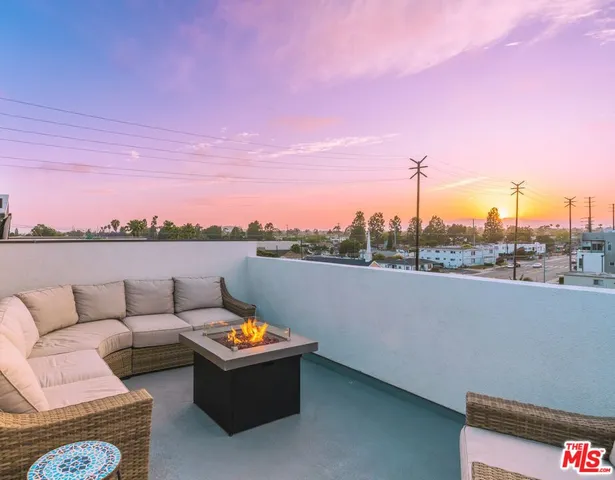 a view of a terrace with furniture