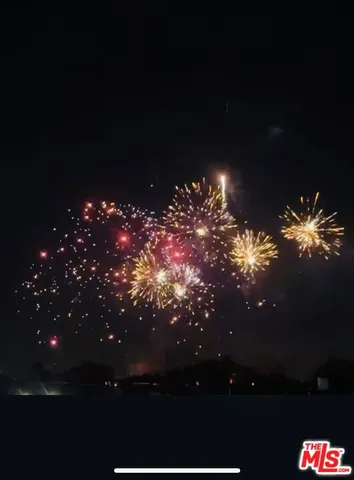 a view of a yard in front of the house with green space