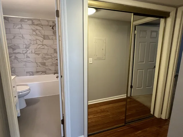 a bathroom with a glass shower door