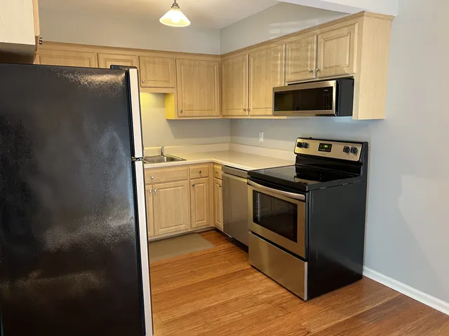 a kitchen with a sink and a microwave