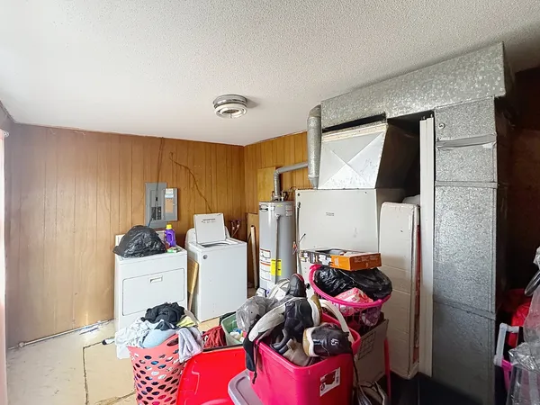 a room with furniture a flat screen tv and a window