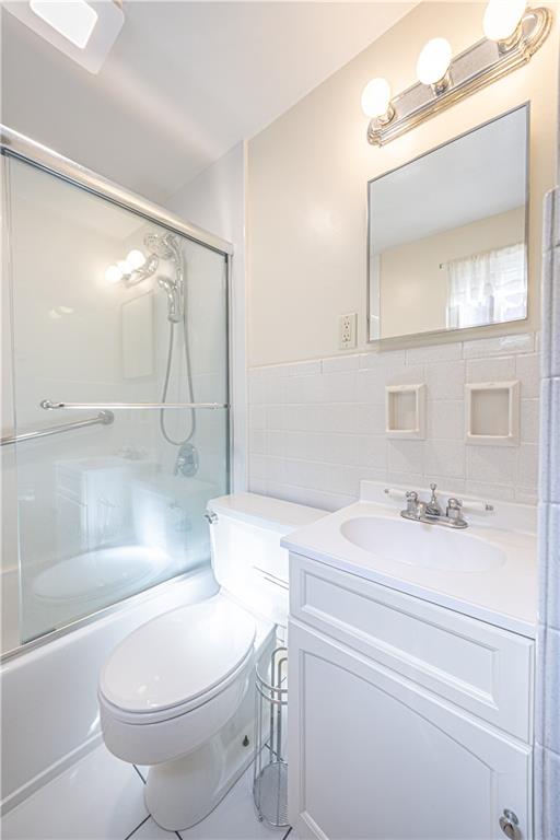103 Cherry Valley Road Pittsburgh, PA 15221 - Photo 15 of 29 a bathroom with a sink a toilet and a mirror
