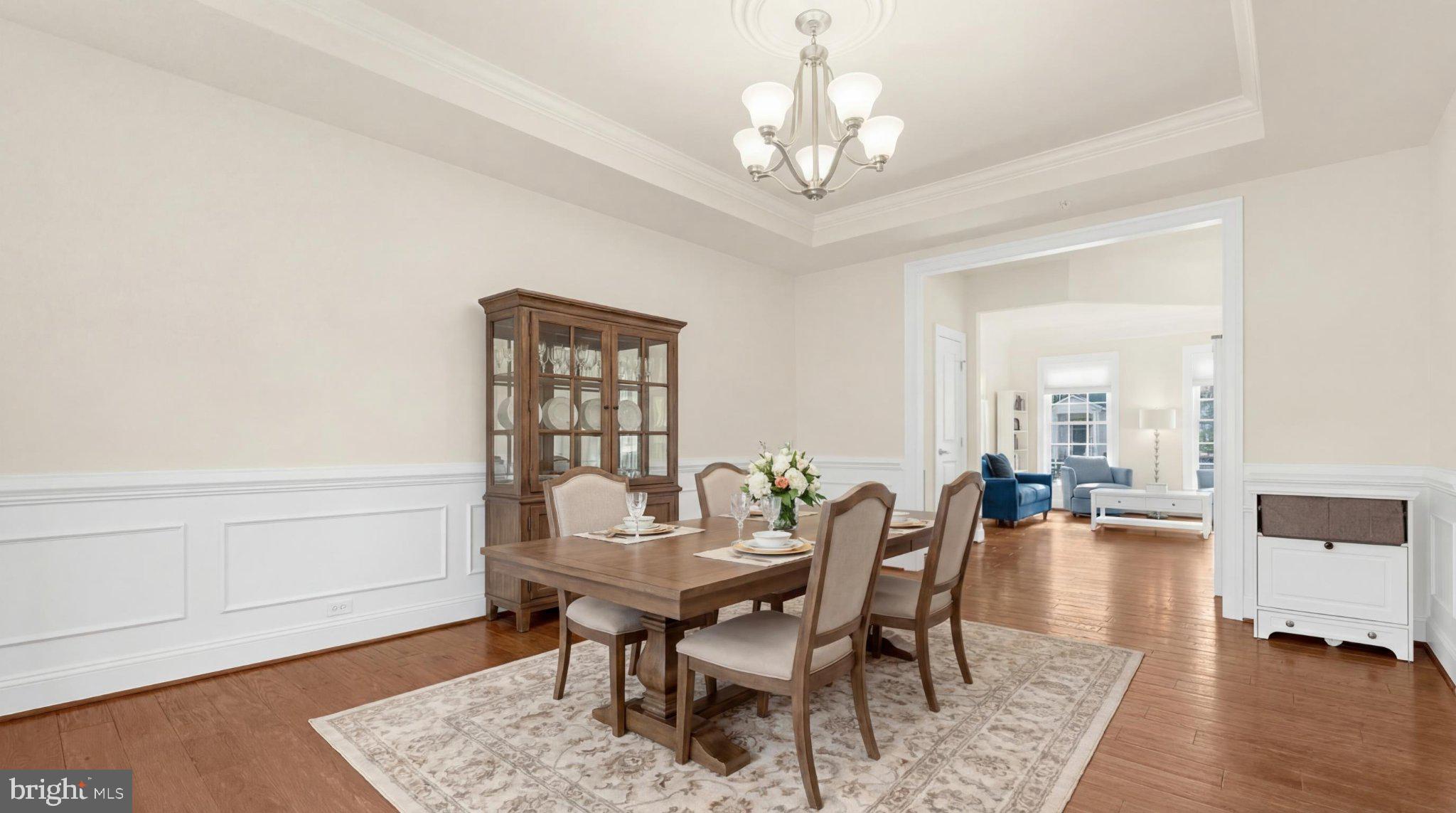 830 Sebastian Lane Gambrills, MD 21054 - Photo 11 of 63 a view of a dining room with furniture and wooden floor