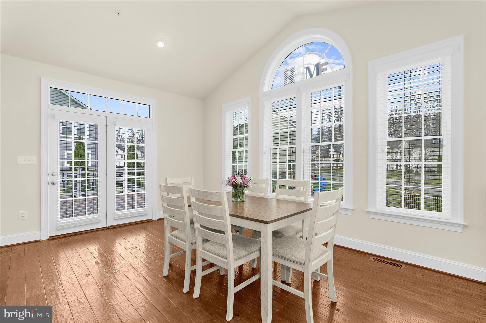830 Sebastian Lane Gambrills, MD 21054 - Photo 17 of 63 a view of a dining room with furniture window and wooden floor