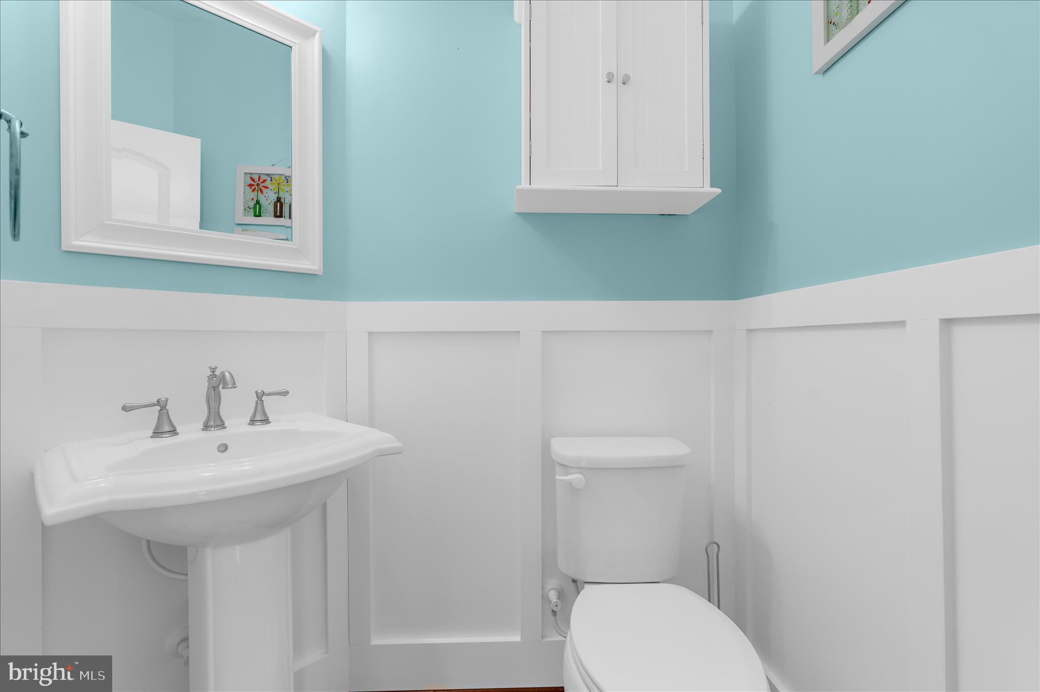 830 Sebastian Lane Gambrills, MD 21054 - Photo 22 of 63 a bathroom with a toilet sink and mirror