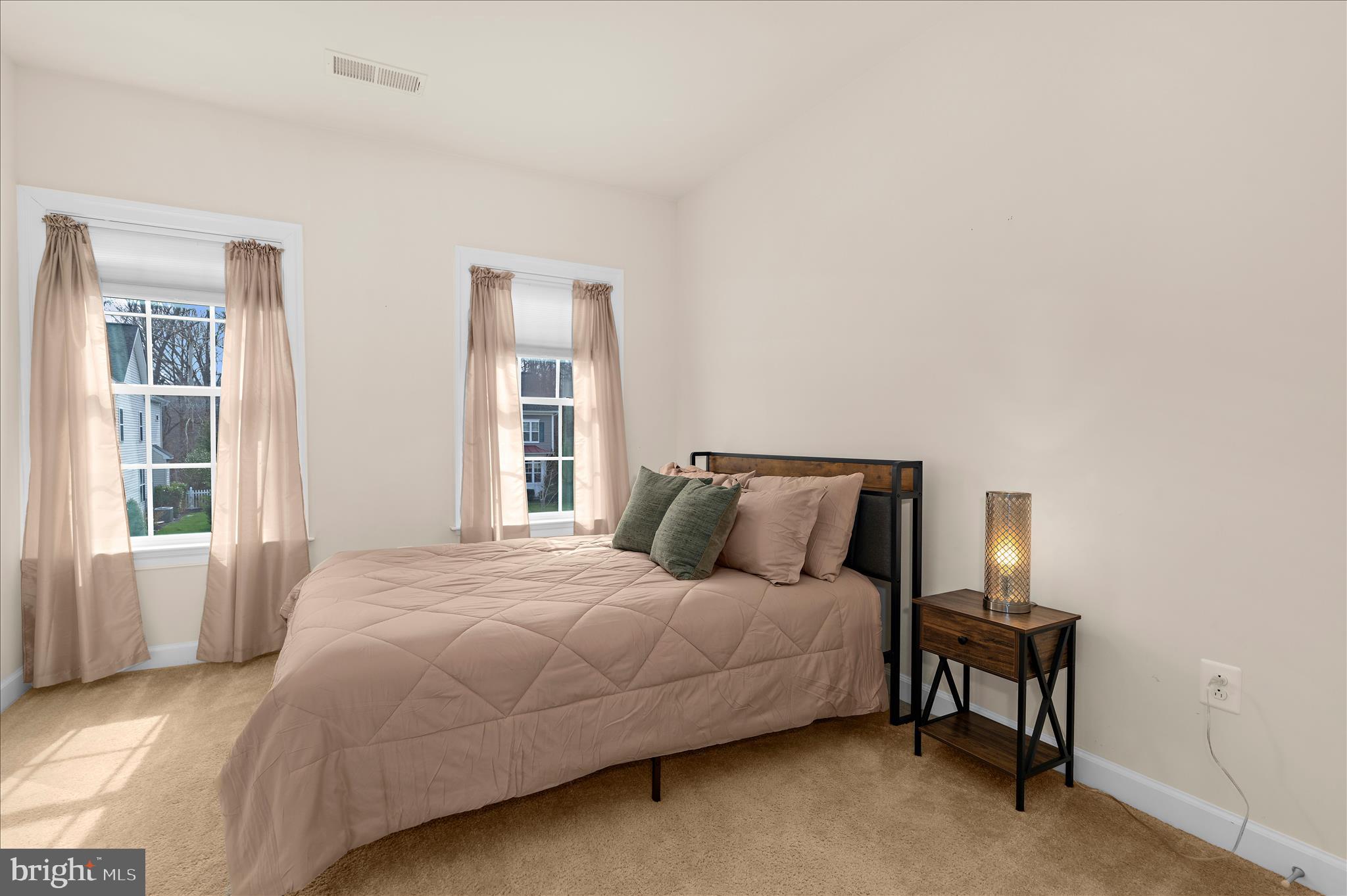 830 Sebastian Lane Gambrills, MD 21054 - Photo 35 of 63 a bedroom with a bed table and chair