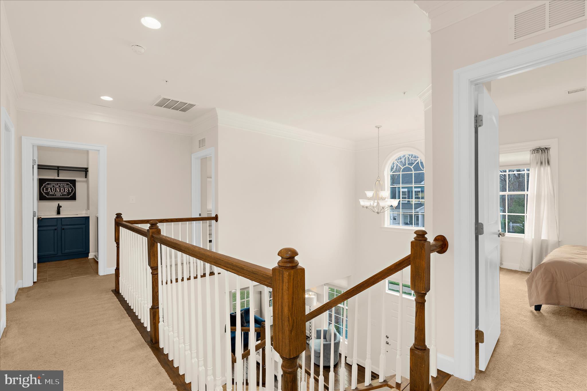 830 Sebastian Lane Gambrills, MD 21054 - Photo 41 of 63 a view of a hallway with windows and stairs