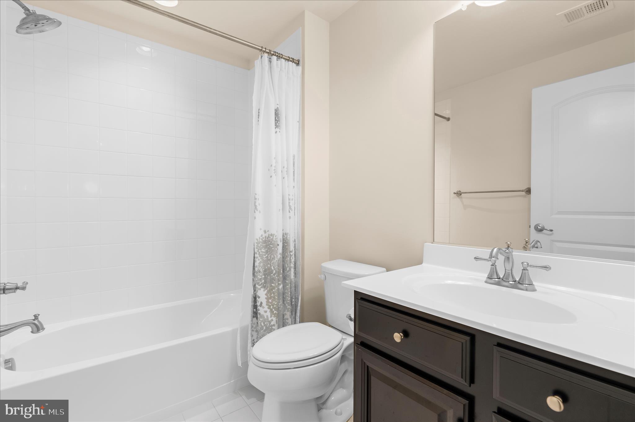 830 Sebastian Lane Gambrills, MD 21054 - Photo 43 of 63 a bathroom with a sink toilet and shower