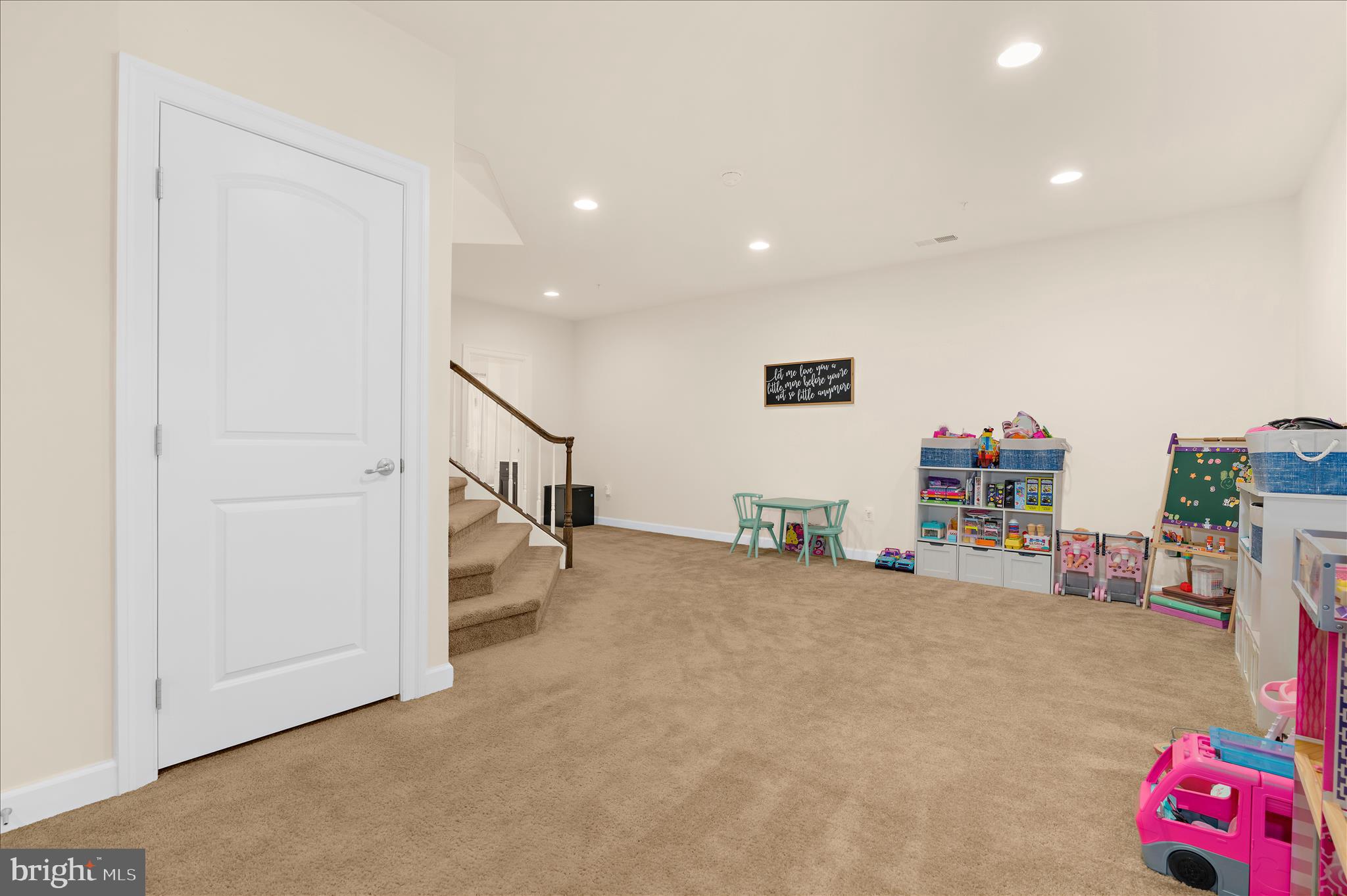 830 Sebastian Lane Gambrills, MD 21054 - Photo 45 of 63 a view of a livingroom with stairs and toys