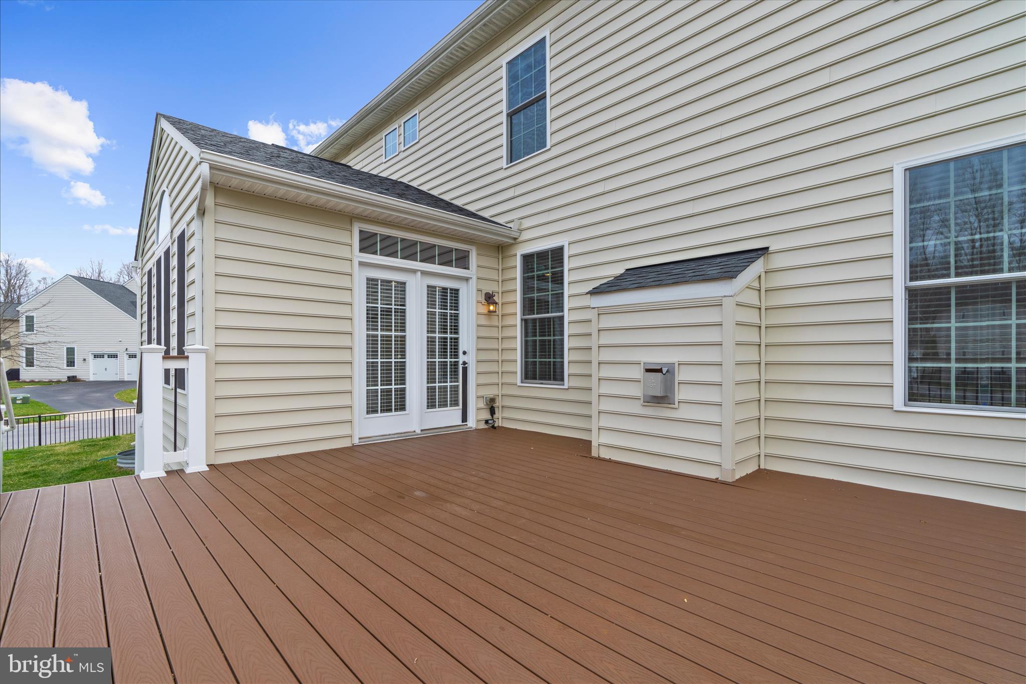 830 Sebastian Lane Gambrills, MD 21054 - Photo 50 of 63 a view of a house with wooden deck