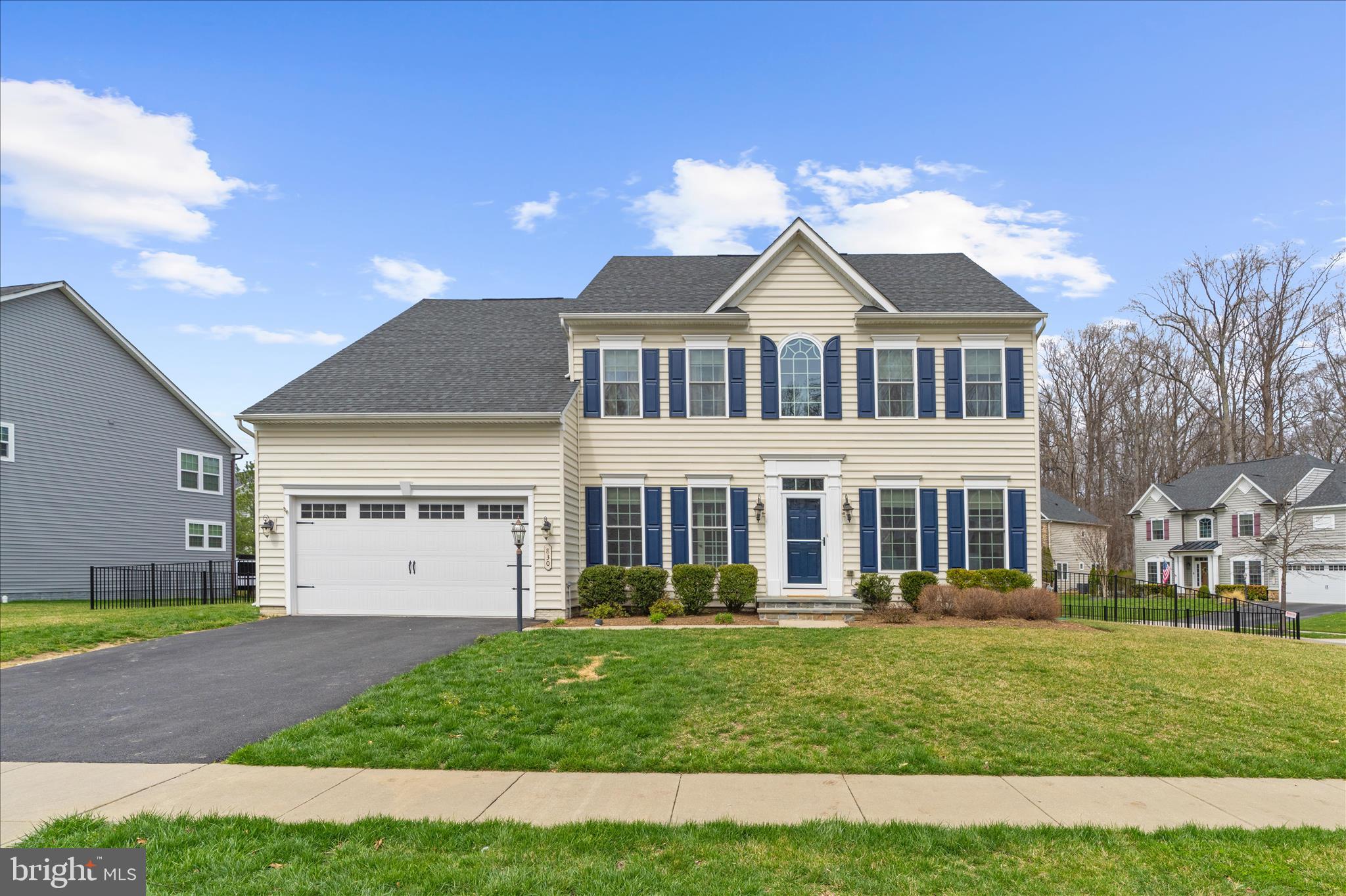 830 Sebastian Lane Gambrills, MD 21054 - Photo 5 of 63 a front view of a house with a yard