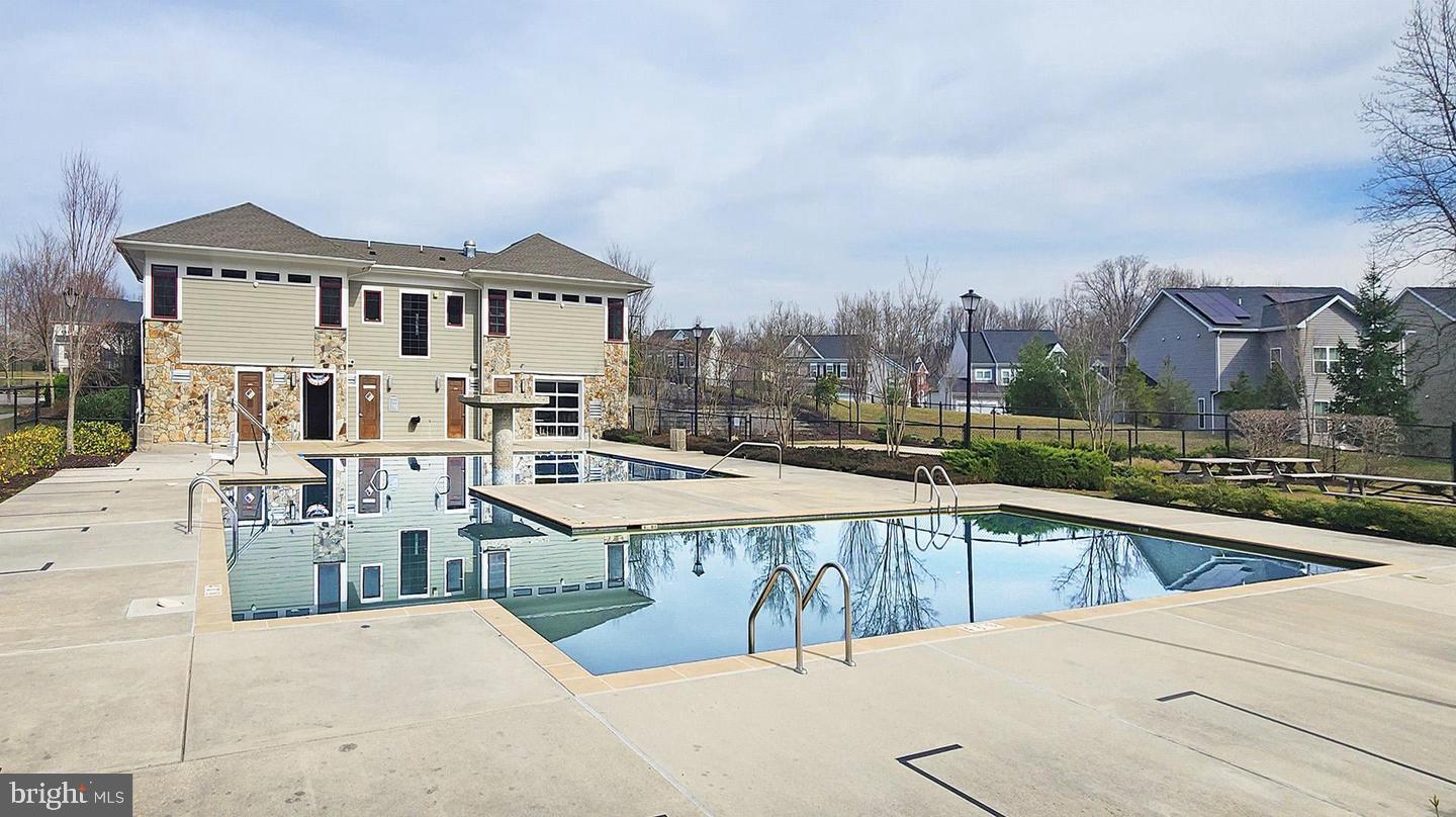 830 Sebastian Lane Gambrills, MD 21054 - Photo 55 of 63 a view of a house with a swimming pool
