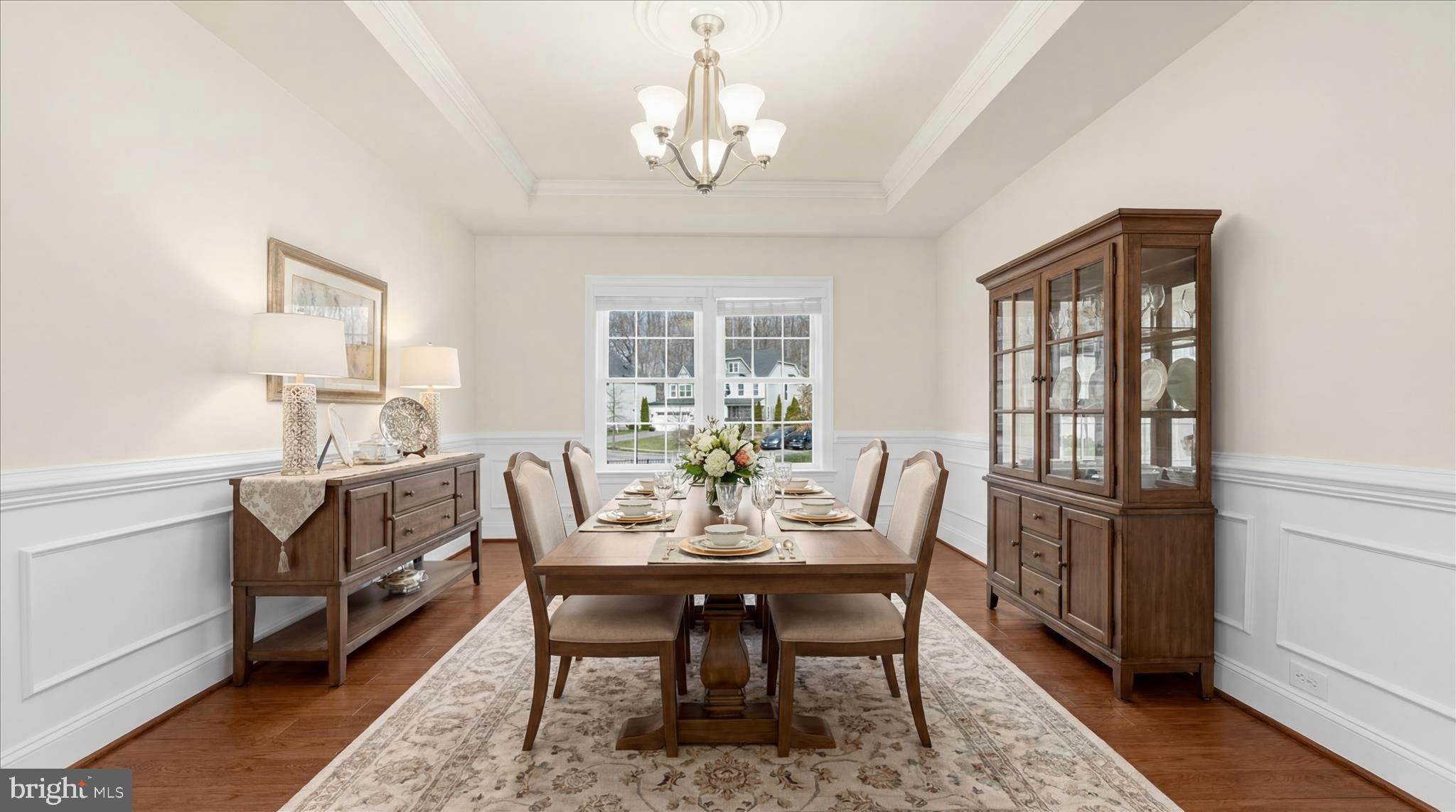 830 Sebastian Lane Gambrills, MD 21054 - Photo 10 of 63 a view of a dining room with furniture window and wooden floor