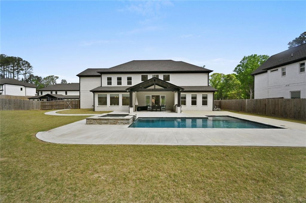 2694 Thompson Mill Road Buford, GA 30519 - Photo 68 of 70 a front view of a house with swimming pool