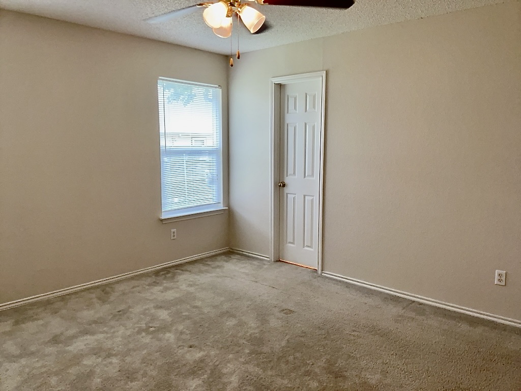 1313 Terra Street Round Rock, TX 78665 - Photo 14 of 25 an empty room with windows and closet