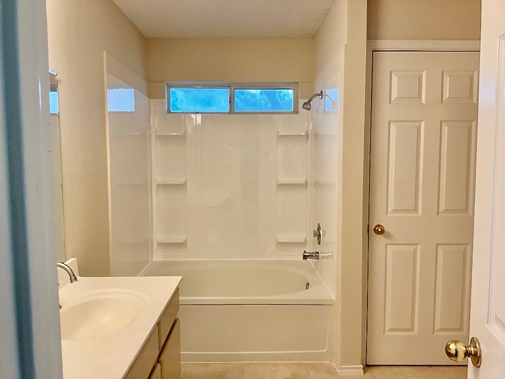 1313 Terra Street Round Rock, TX 78665 - Photo 16 of 25 a bathroom with a shower