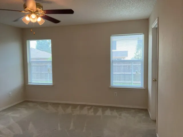a bathroom with a tub shower and a sink