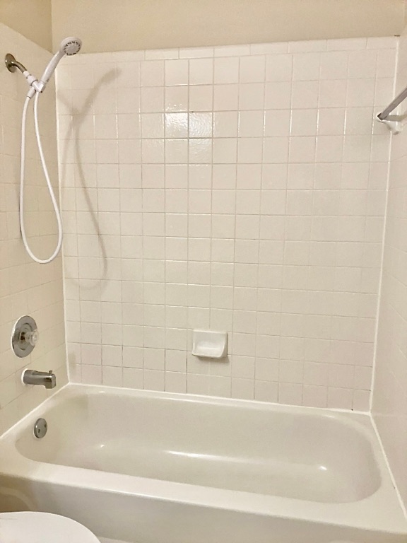 1313 Terra Street Round Rock, TX 78665 - Photo 20 of 25 a bathroom with a shower and a bath tub