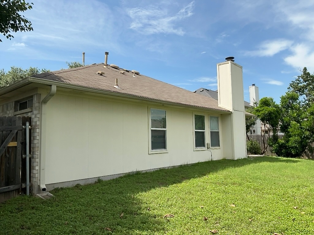 1313 Terra Street Round Rock, TX 78665 - Photo 24 of 25 a view of a house with a backyard