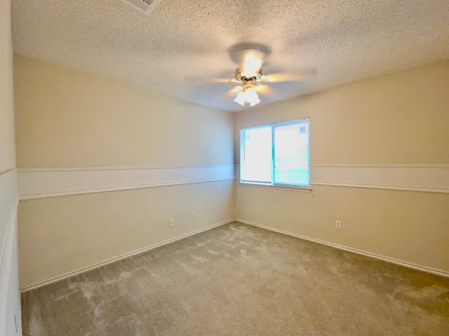 an empty room with closet area
