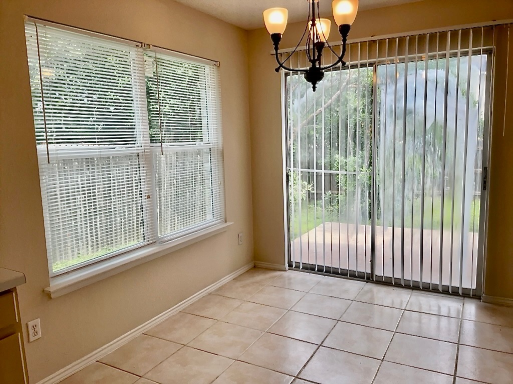 1313 Terra Street Round Rock, TX 78665 - Photo 9 of 25 a view of a bathroom with a glass door