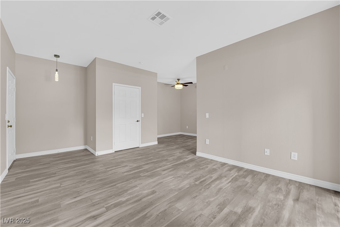 231 West Horizon Ridge Parkway, Unit 1313 Henderson, NV 89012 - Photo 3 of 20 Empty room featuring light wood-style flooring and a ceiling fan
