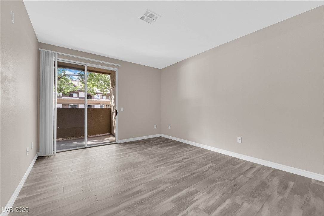231 West Horizon Ridge Parkway, Unit 1313 Henderson, NV 89012 - Photo 4 of 20 Spare room with light wood-style flooring and baseboards