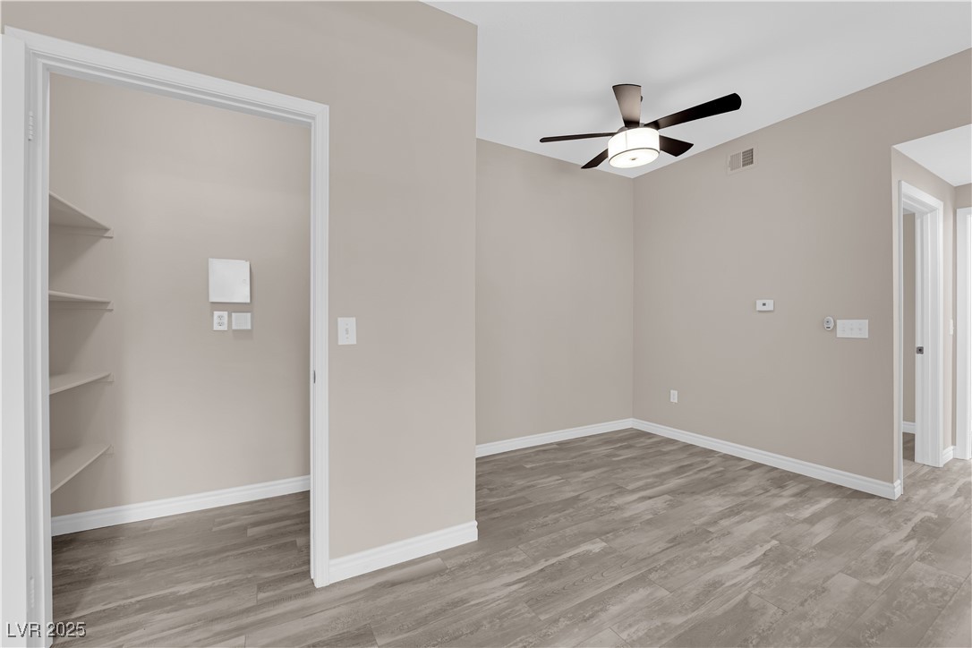 231 West Horizon Ridge Parkway, Unit 1313 Henderson, NV 89012 - Photo 5 of 20 Spare room with light wood-style flooring and a ceiling fan
