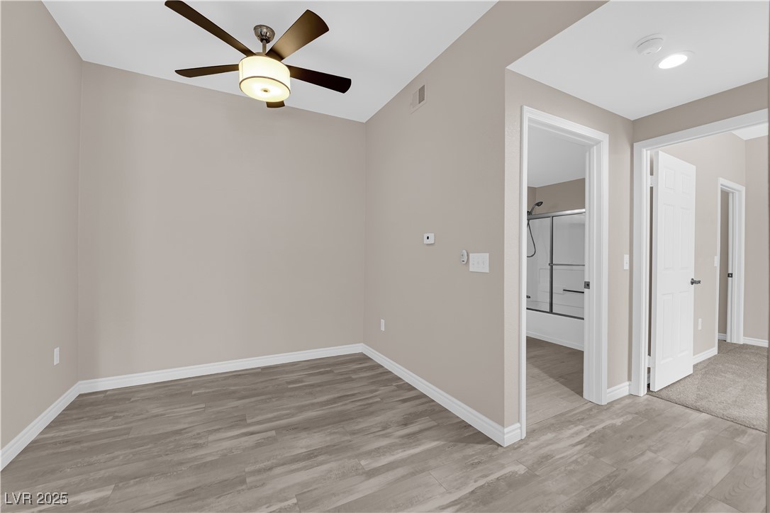 231 West Horizon Ridge Parkway, Unit 1313 Henderson, NV 89012 - Photo 6 of 20 Empty room with light wood finished floors and a ceiling fan