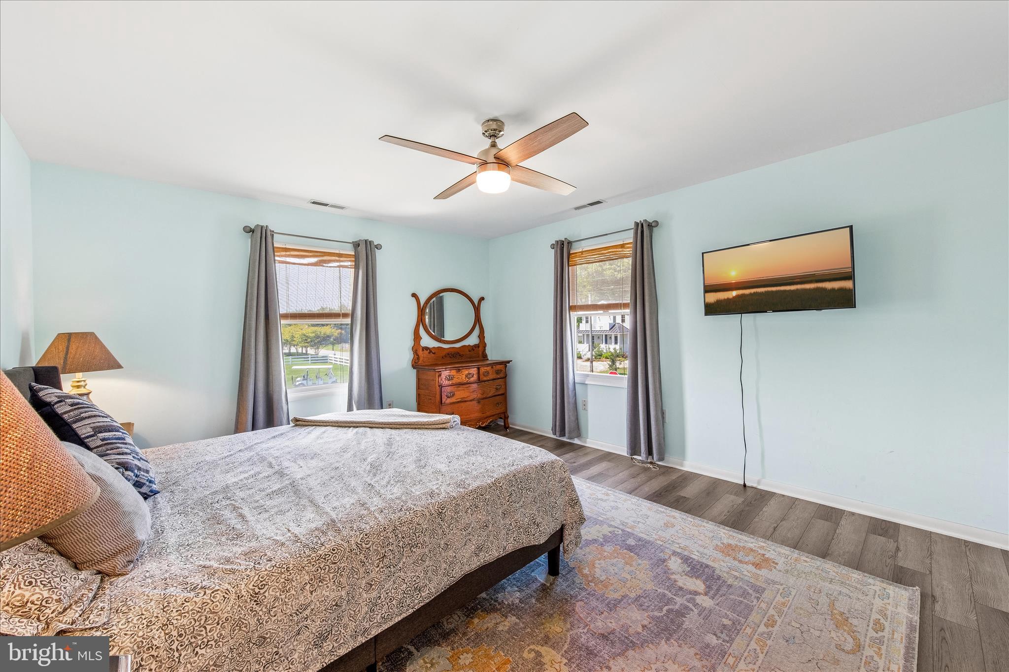 21406 Dogwood Cove Road Tilghman, MD 21671 - Photo 56 of 68 a bedroom with a bed and a tv on dresser