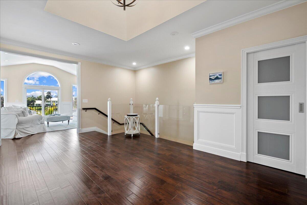 169 Apollo Circle Jupiter, FL 33477 - Photo 14 of 39 a view of a room with wooden floor lounge chair and windows
