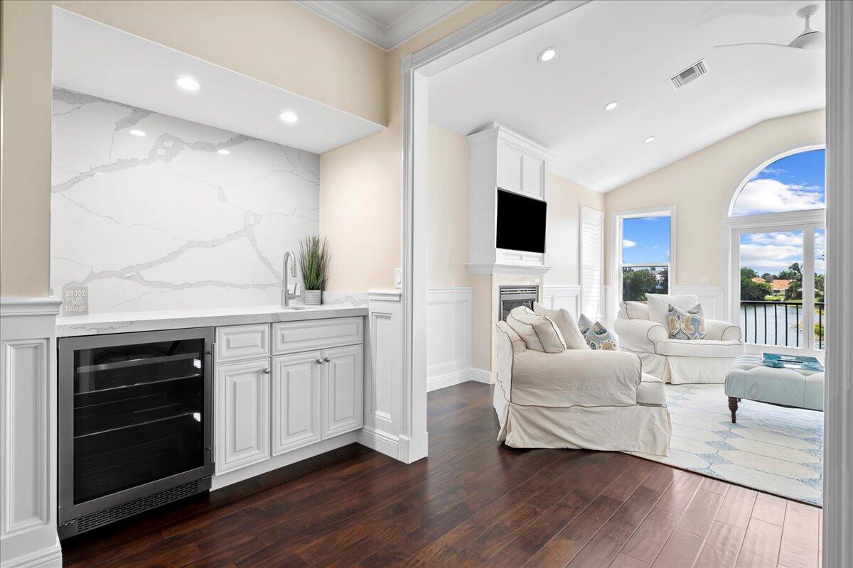 169 Apollo Circle Jupiter, FL 33477 - Photo 15 of 39 a large living room with stainless steel appliances kitchen island granite countertop a couch and a view of living room