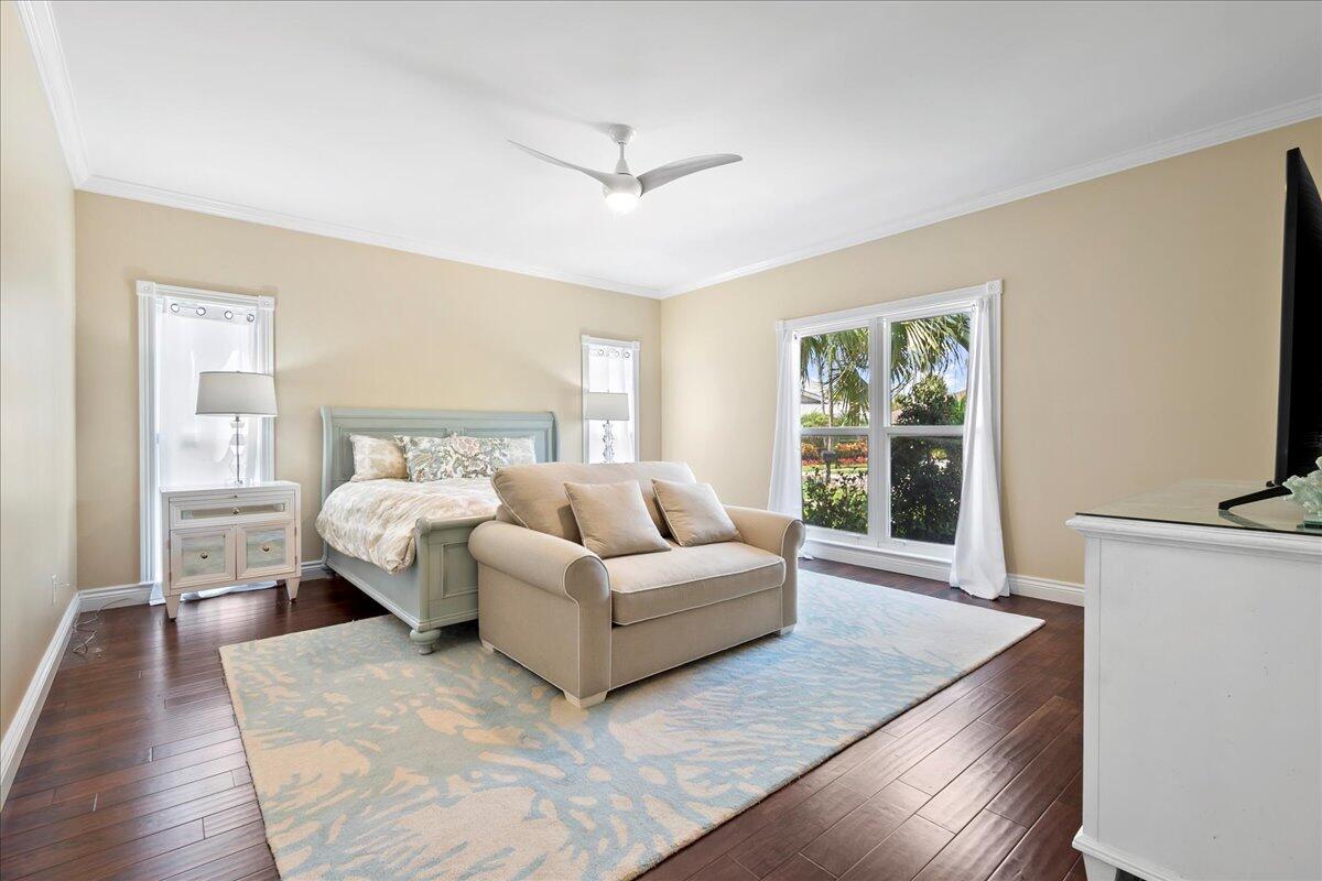 169 Apollo Circle Jupiter, FL 33477 - Photo 23 of 39 a bedroom with a large bed and a couch