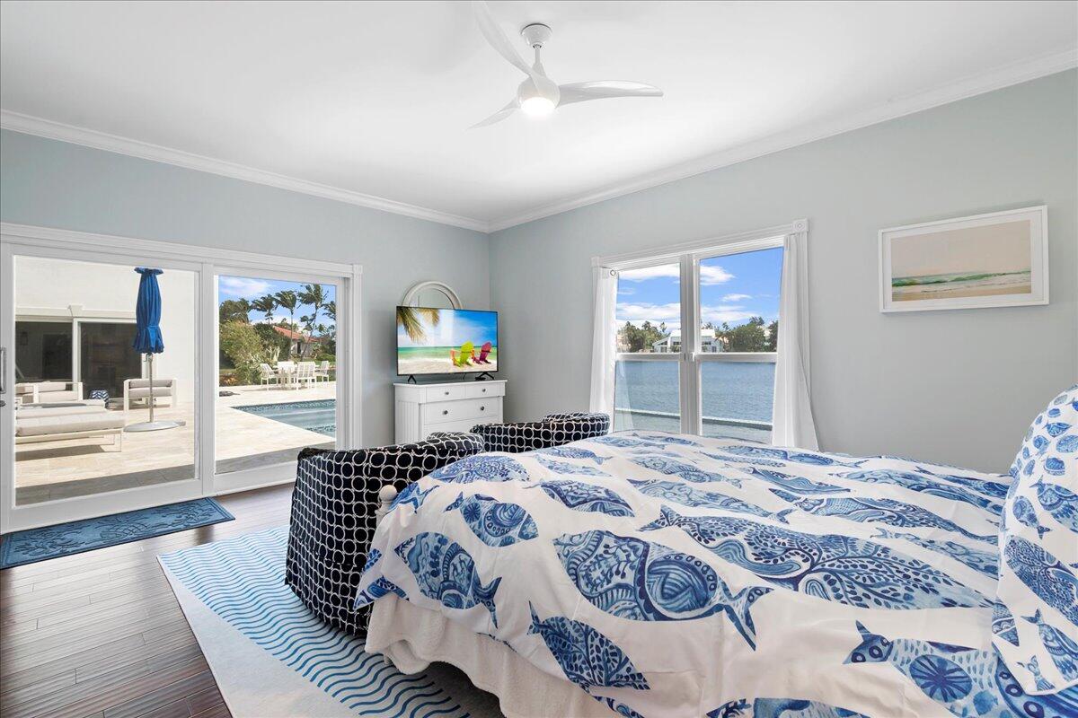 169 Apollo Circle Jupiter, FL 33477 - Photo 30 of 39 a bedroom with a bed and wooden floor