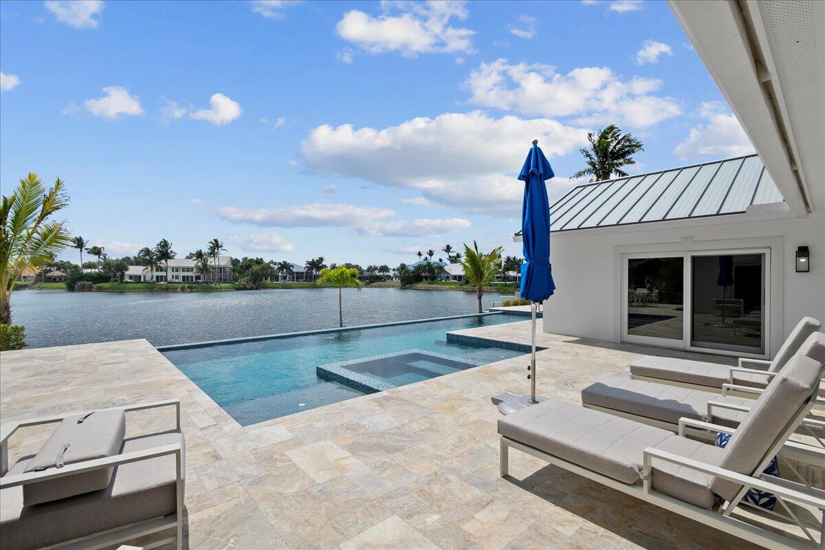 169 Apollo Circle Jupiter, FL 33477 - Photo 31 of 39 a view of swimming pool with seating area and barbeque oven