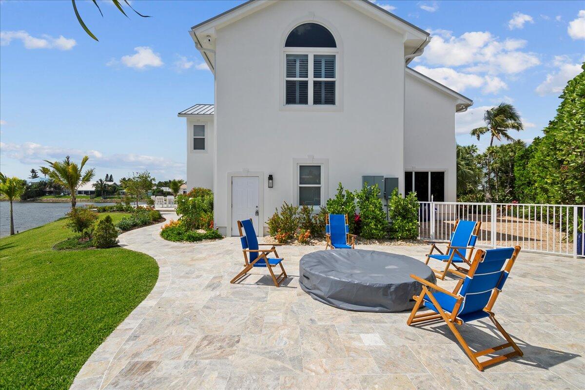 169 Apollo Circle Jupiter, FL 33477 - Photo 33 of 39 a view of a backyard with furniture and garden