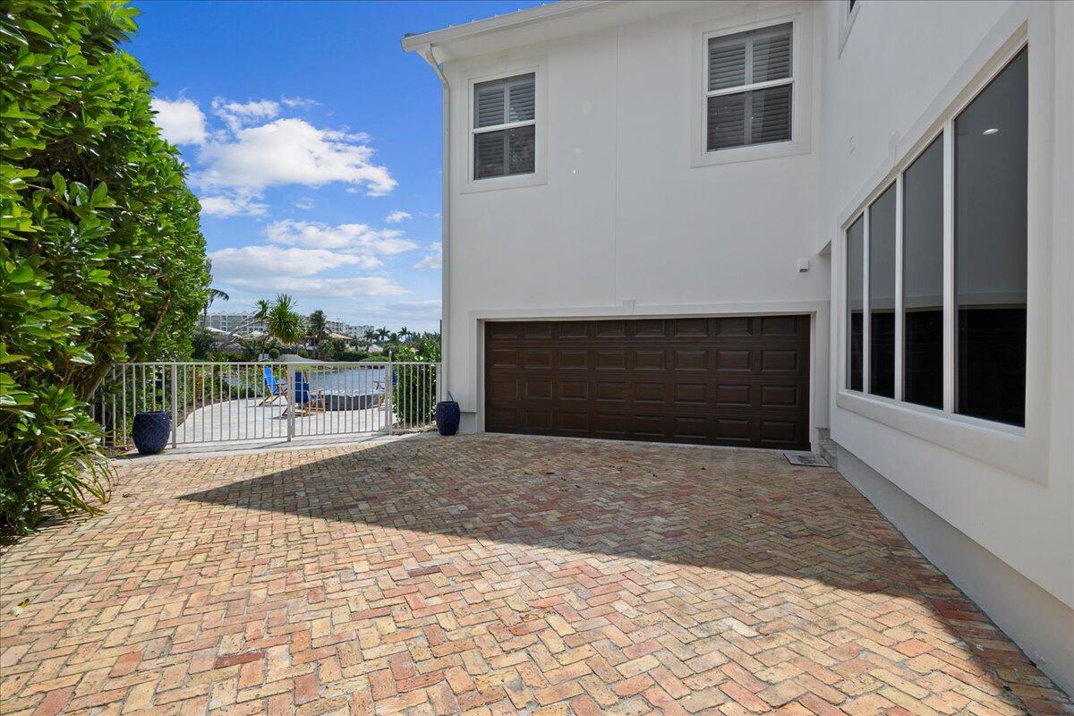 169 Apollo Circle Jupiter, FL 33477 - Photo 34 of 39 a front view of a house with a yard
