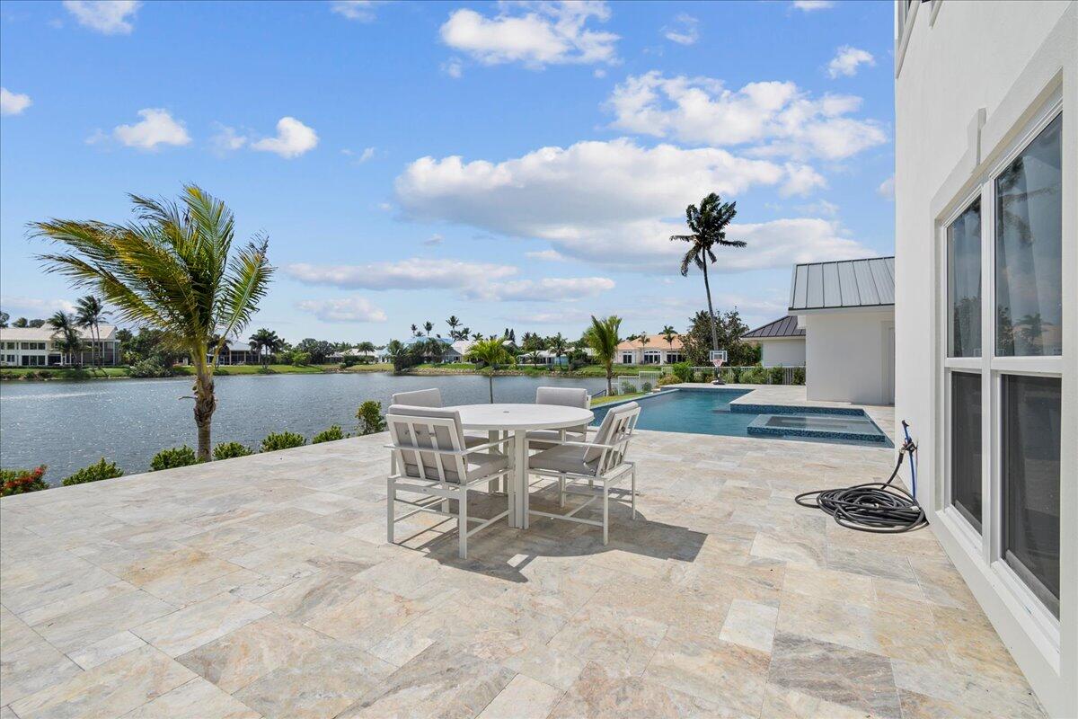 169 Apollo Circle Jupiter, FL 33477 - Photo 35 of 39 a view of a patio with a table and chairs