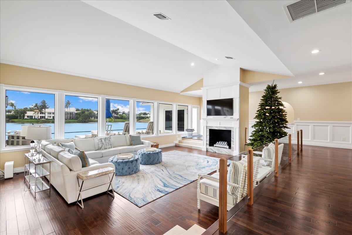 169 Apollo Circle Jupiter, FL 33477 - Photo 7 of 39 a living room with fireplace furniture and a fireplace