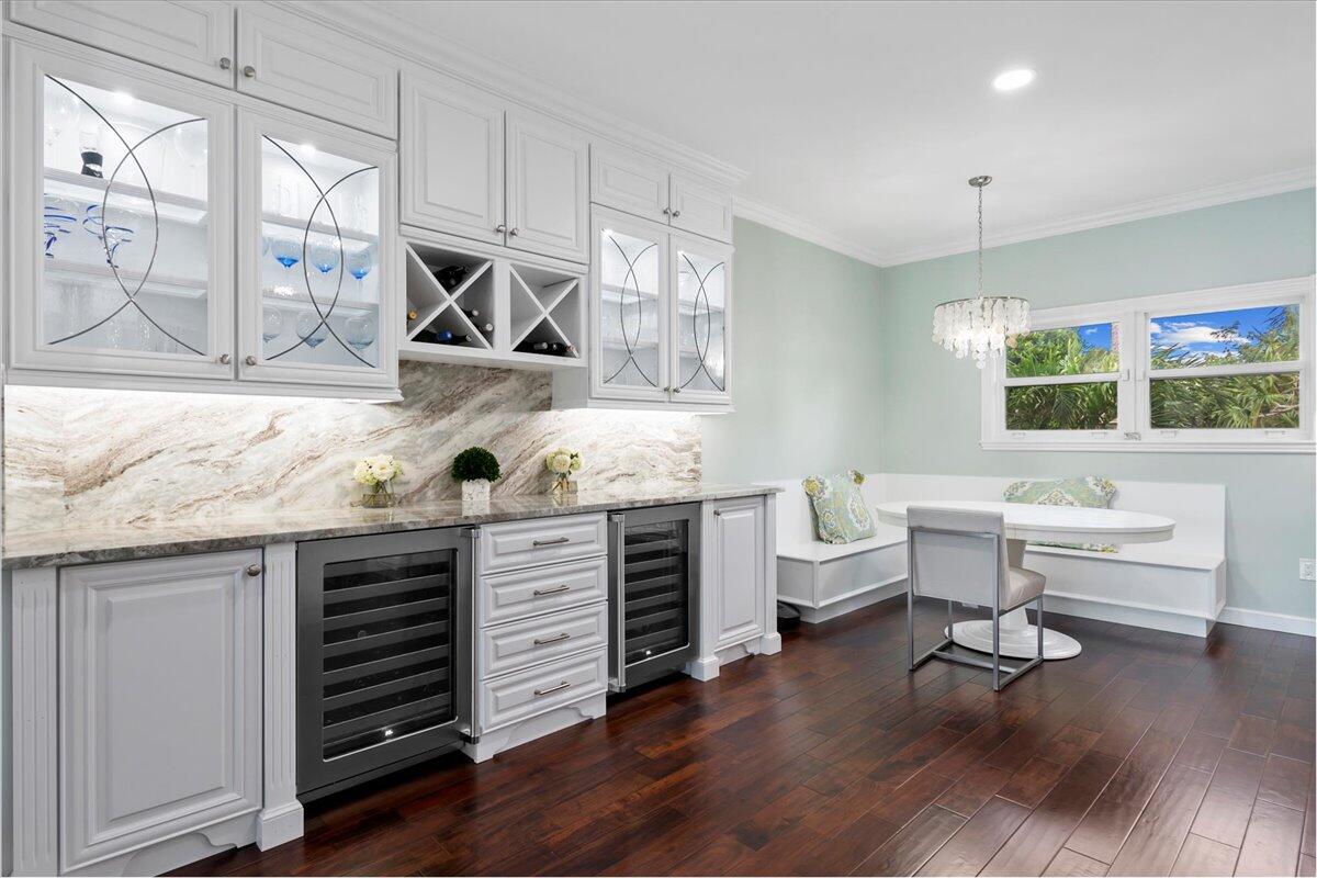 169 Apollo Circle Jupiter, FL 33477 - Photo 10 of 39 a kitchen with sink cabinets and wooden floor