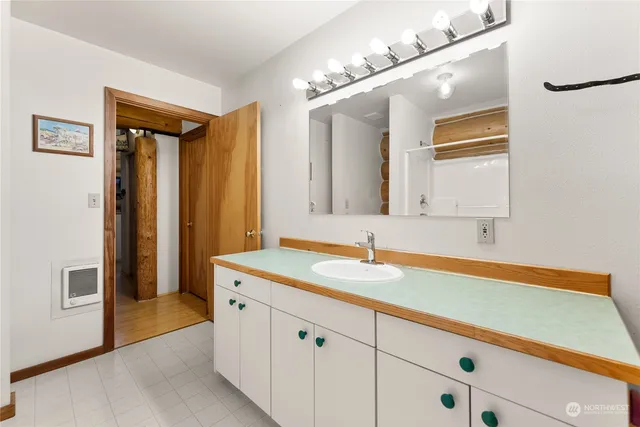 a view of a hallway and a livingroom with furniture