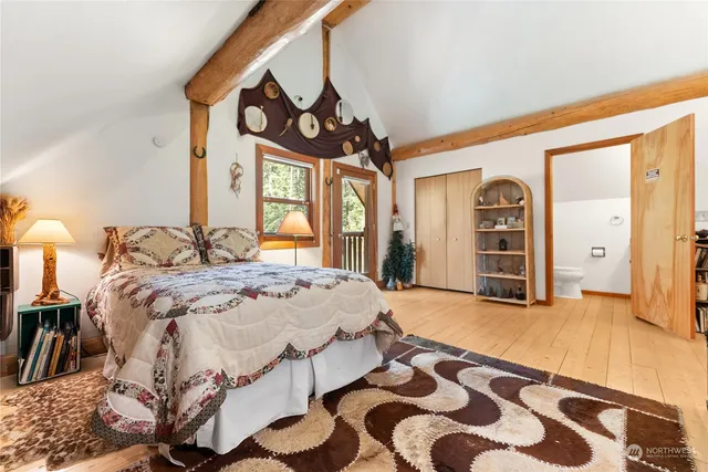 a bedroom with furniture and a window