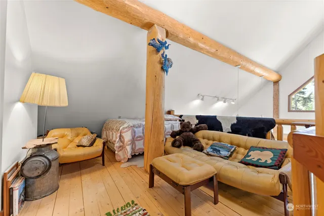 a bathroom with a granite countertop toilet sink and mirror