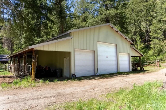 a view of a house with backyard porch and sitting area