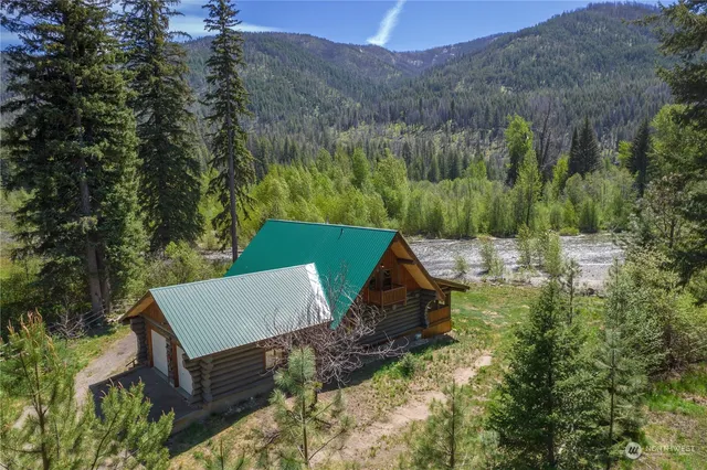 a patio with wooden floor and outdoor seating