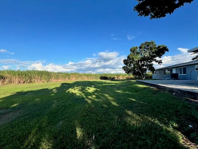 a view of an house with a big yard