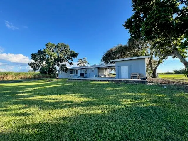 a view of a house with a big yard
