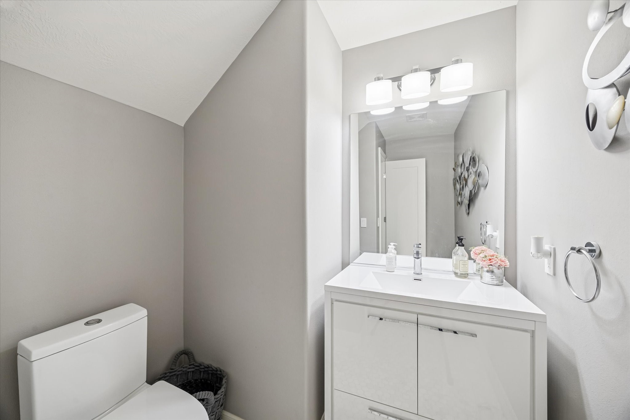 21018 Kings River Point Kingwood, TX 77346 - Photo 16 of 50 a bathroom with a sink a toilet and a mirror